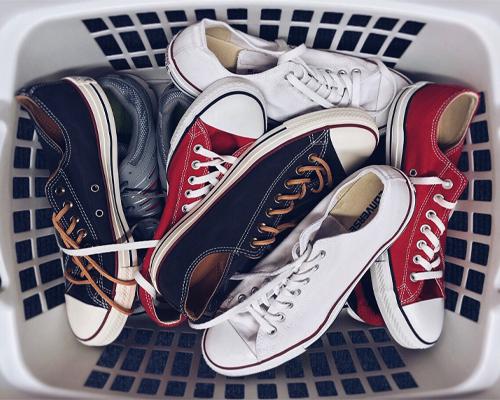 New children's shoes collected in a donation basket